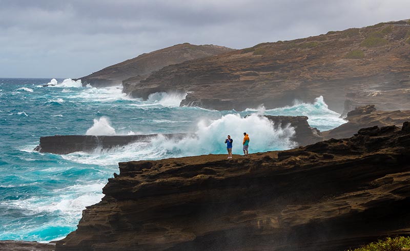 Giant surf generated by a hurricane pounds the cliffs on Oahu’s east shore.