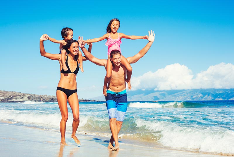 Family playing on beach