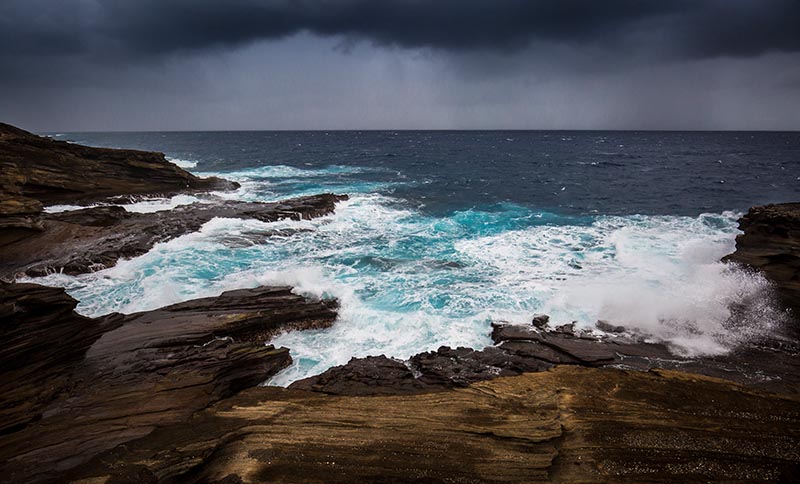 Both offshore and nearshore storms can affect beach conditions and your safety. Evan Austen/Shutterstock.com