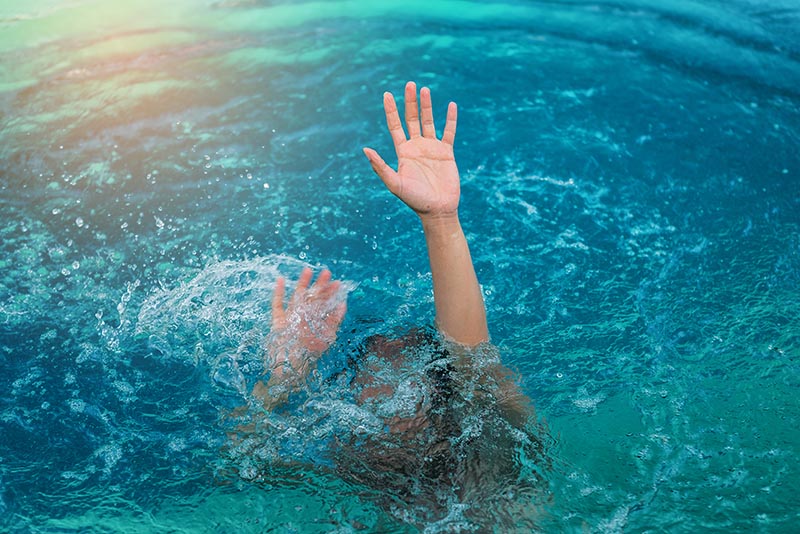 woman drowning in ocean