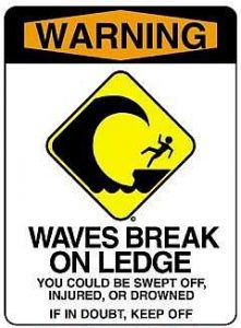 waves break on ledge
